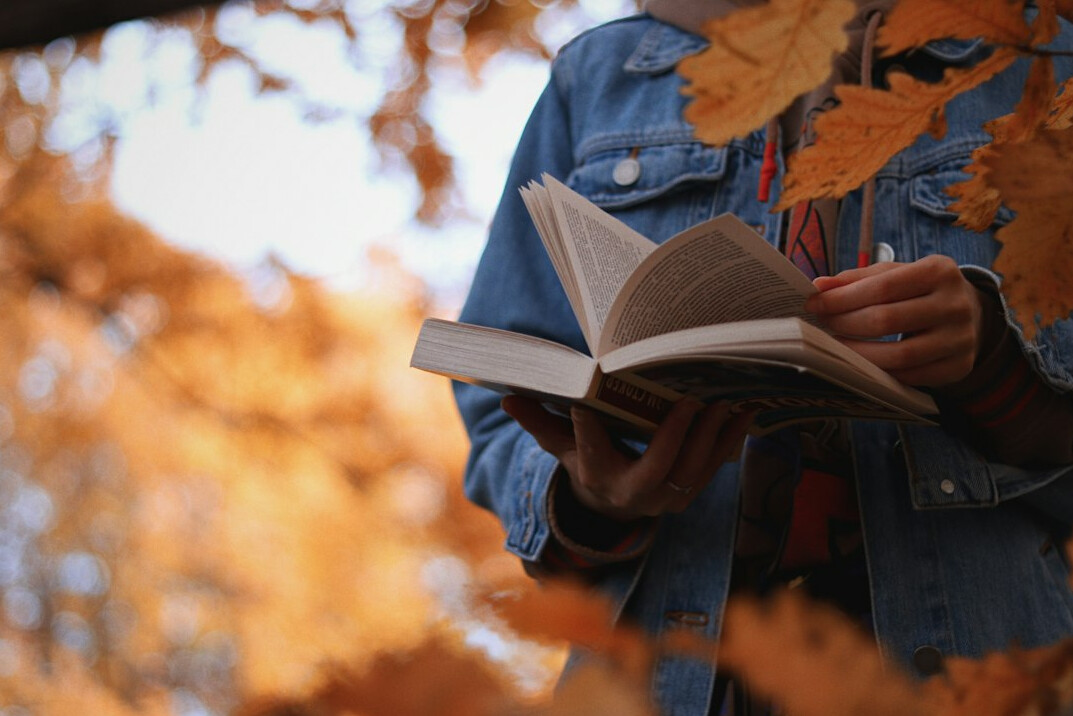 person reading book about communication