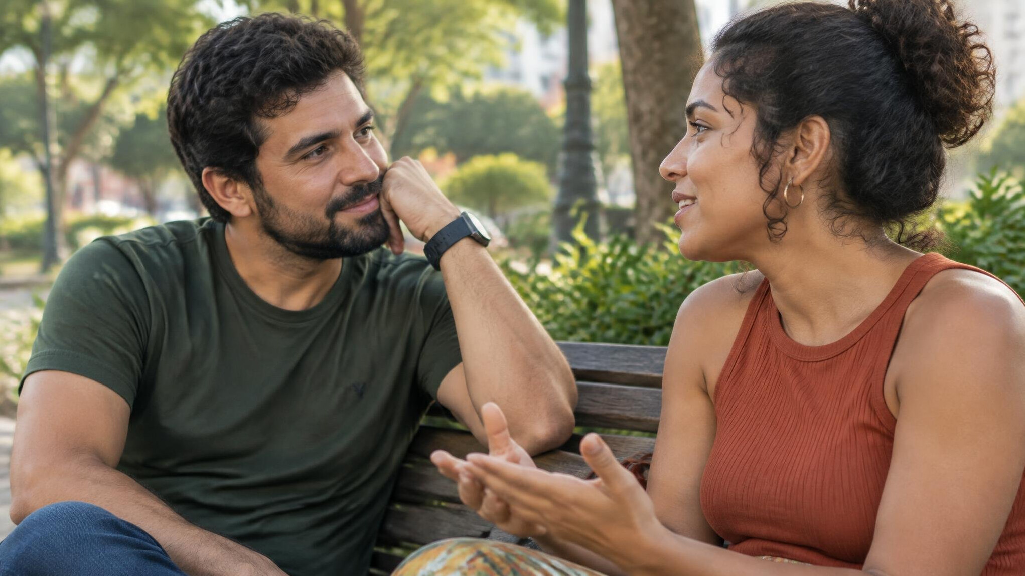 Two people having a warm, attentive conversation outdoors